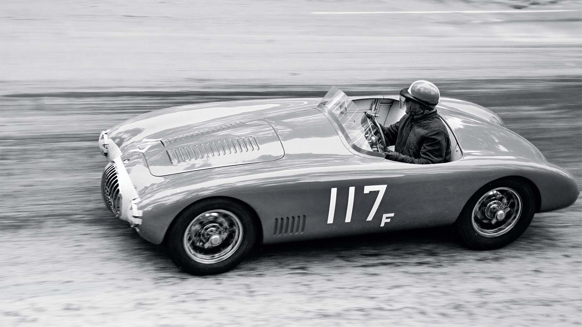 Vintage race car with number 117F on a track