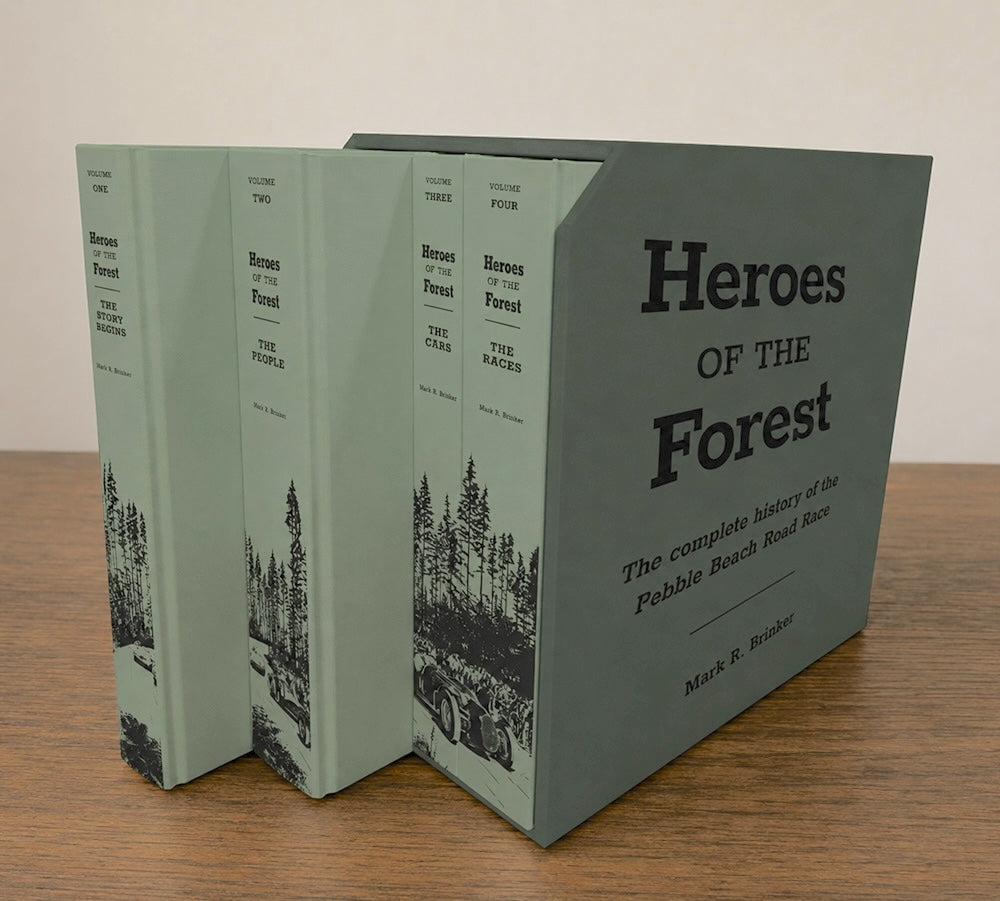 Book titled 'Heroes of the Forest' on a wooden surface with a plain background